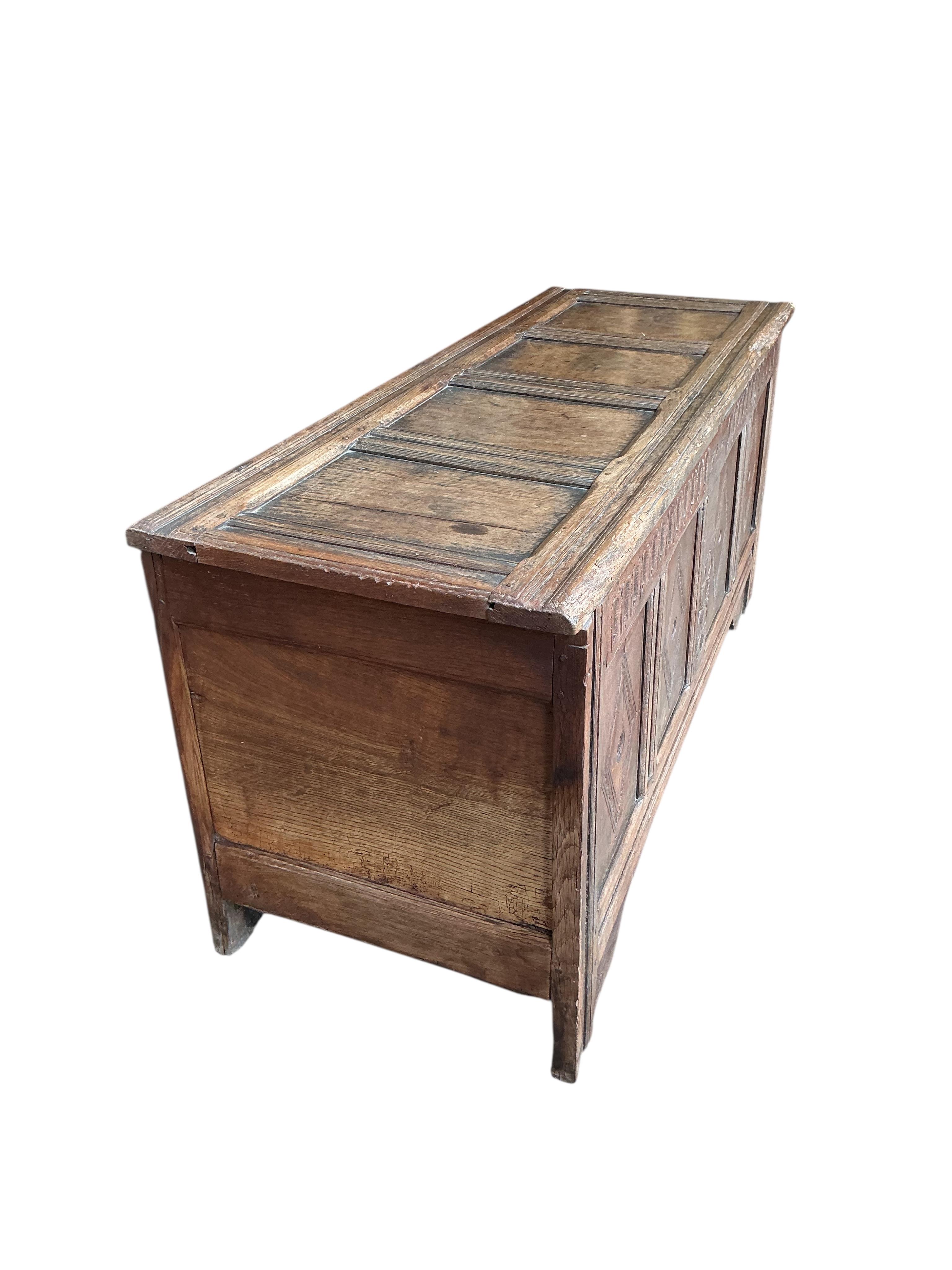 A carved oak coffer, width 146cm, depth 53cm, height 67cm